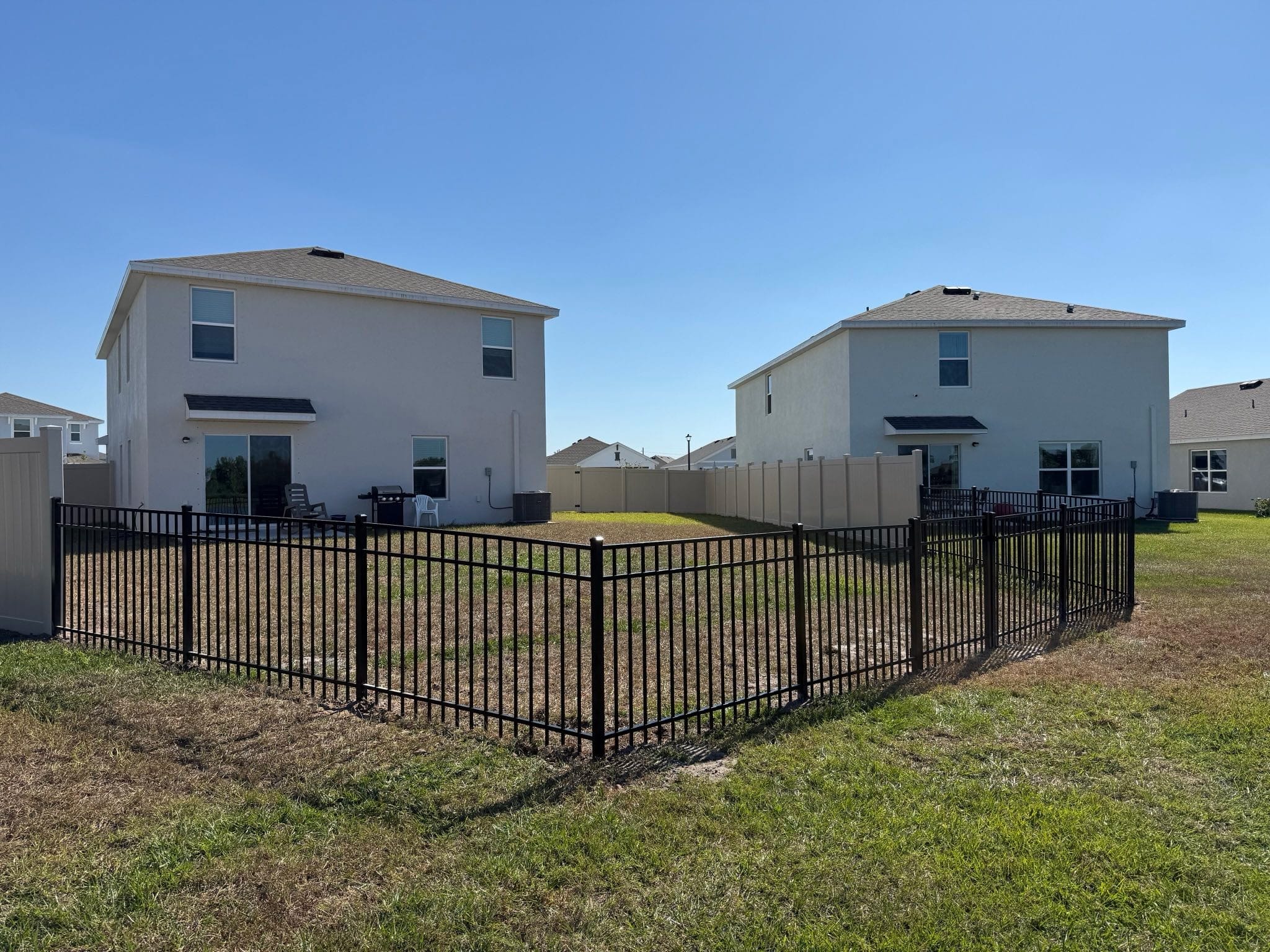 Black aluminum fence in a Florida neighborhood built by Wilson's Fencing