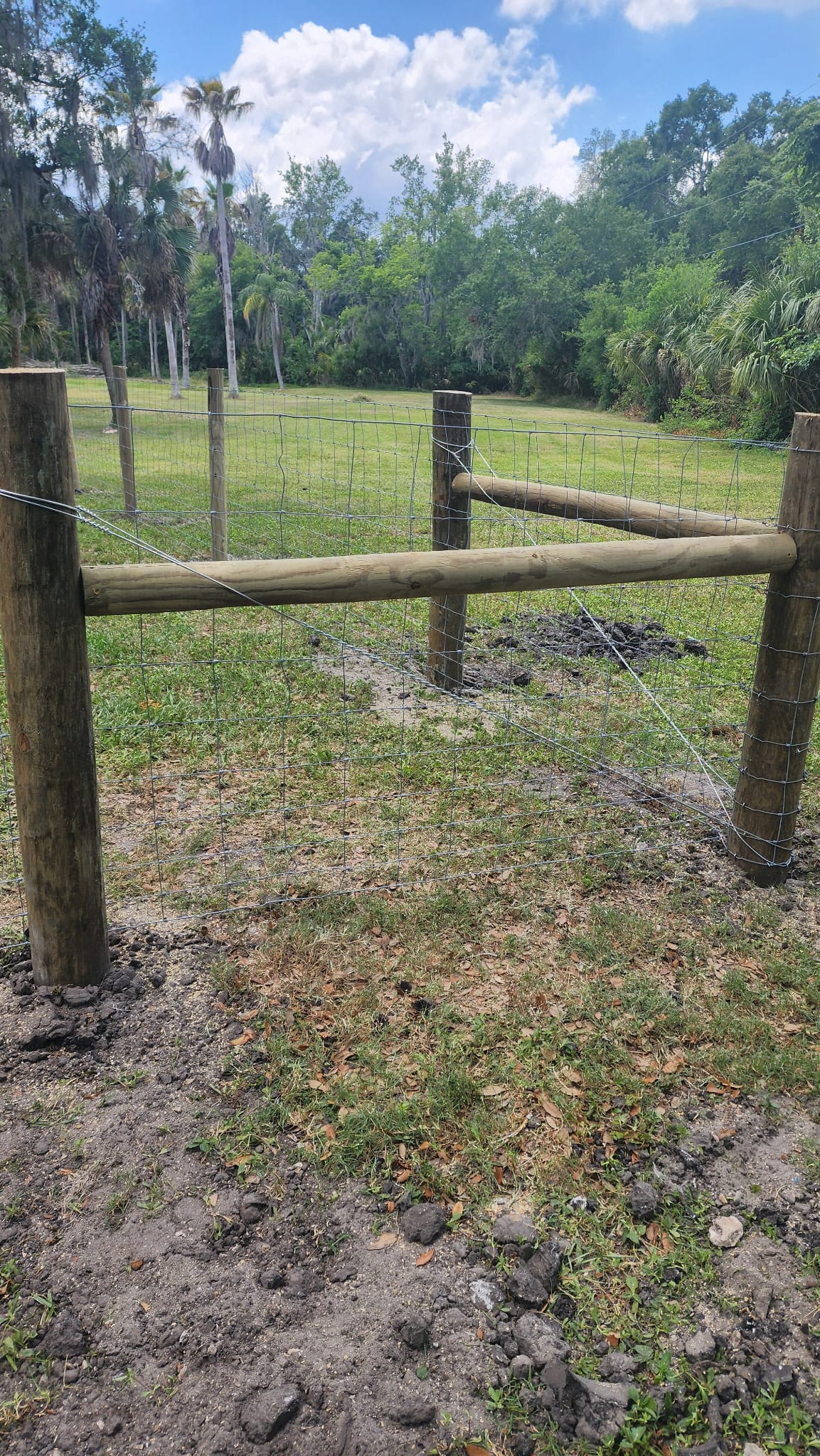 Field and wire agricultural fence with wood corner brace built by Wilson's Fencing
