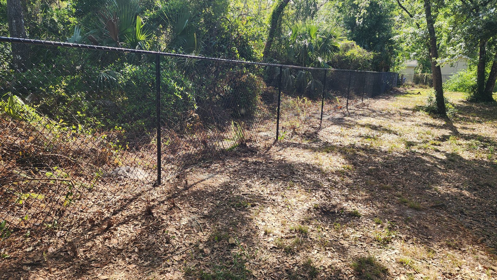 Black chainlink fence built by Wilson's Fencing