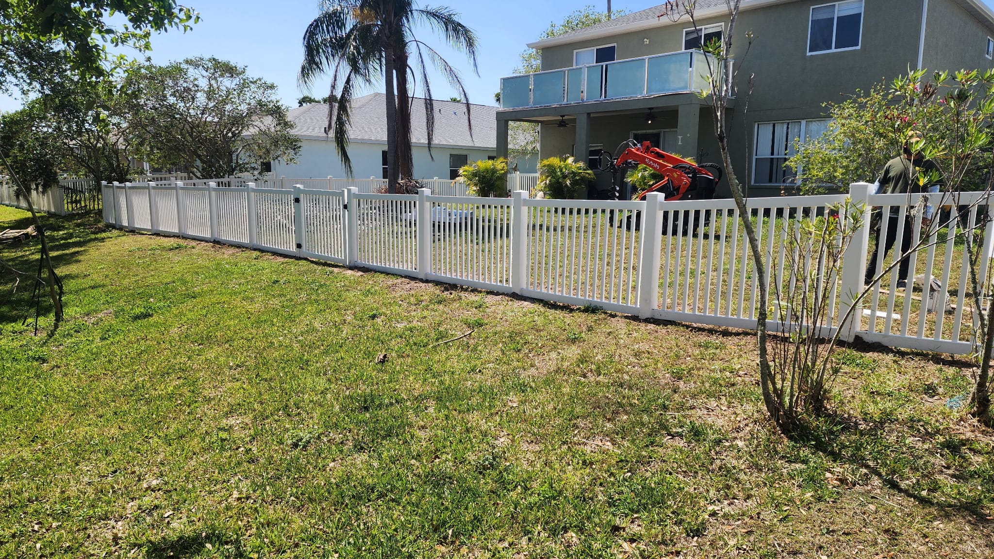 White vinyl picket fence installed by Wilson's Fencing